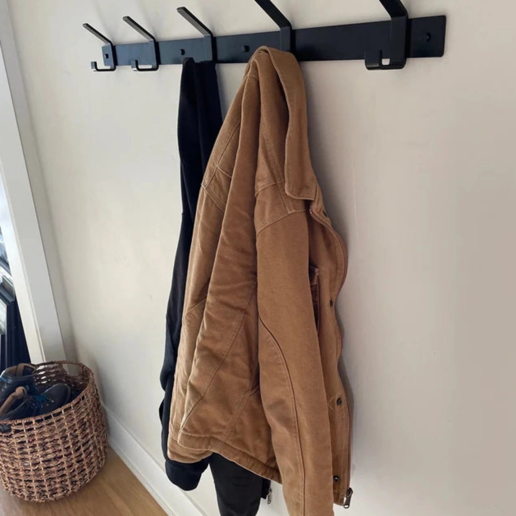 wall mounted black coat rack with jacket