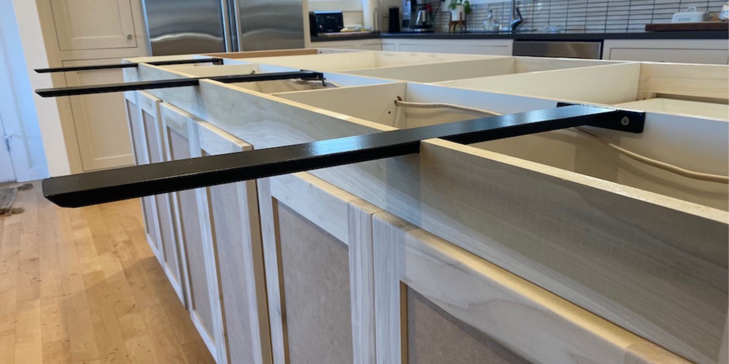 hidden countertop bracket on a wood kitchen island
