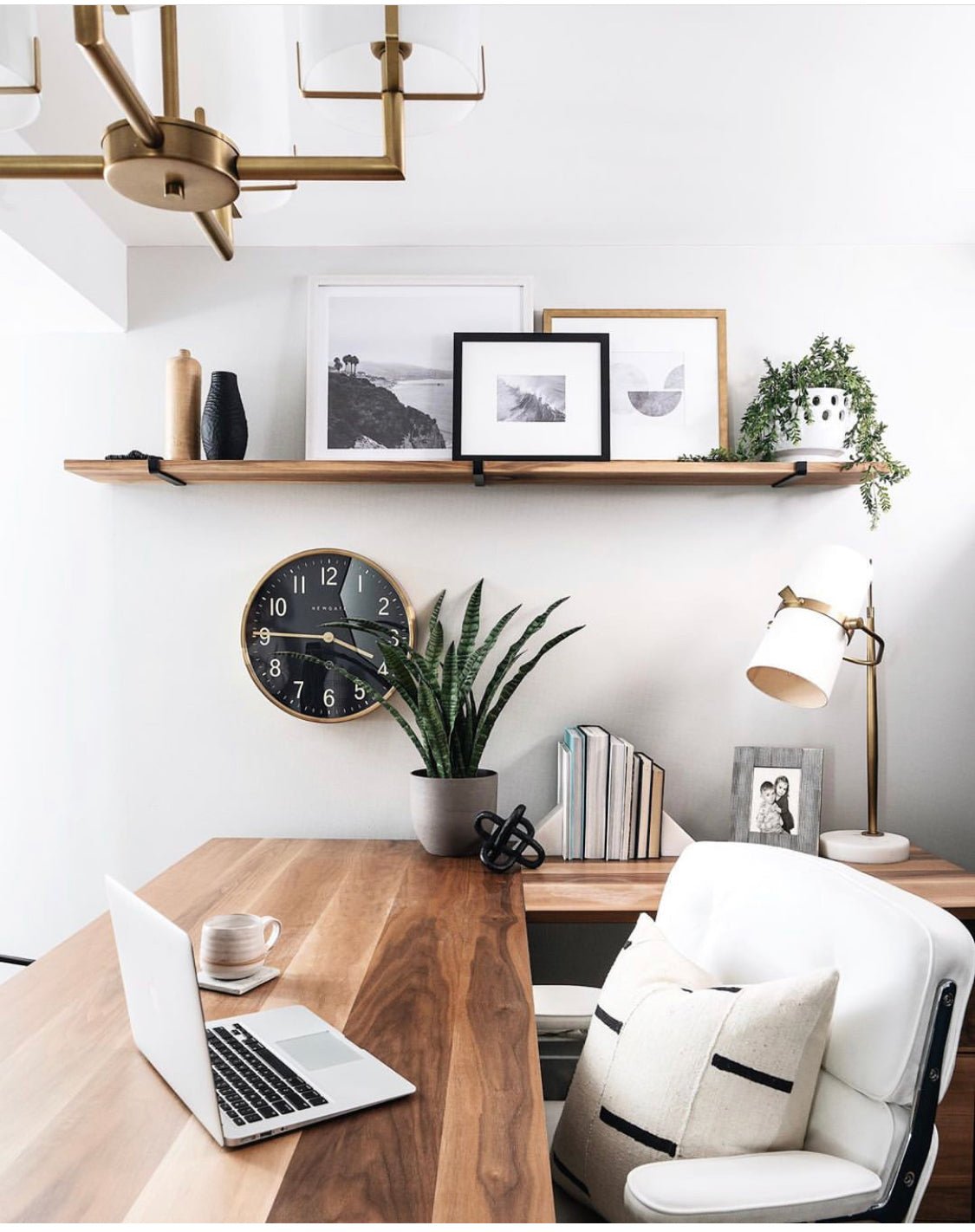 office with floating shelves made with and metal J brackets and neutral decoe