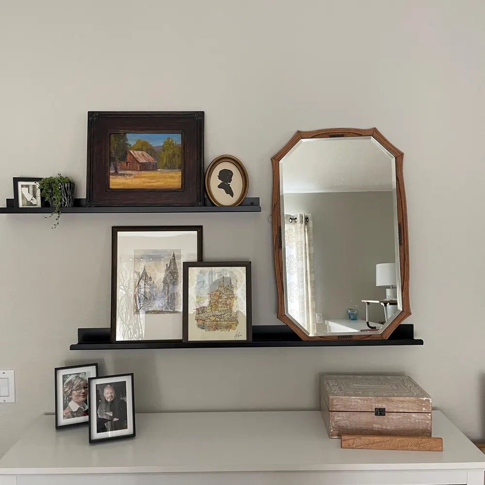 metal wall shelves with art work