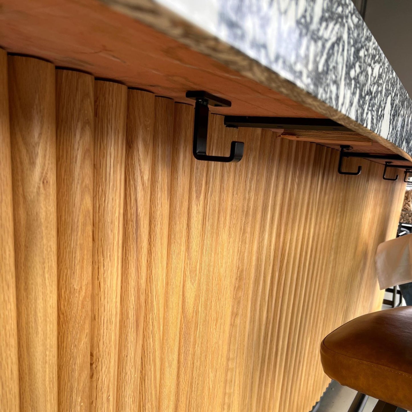 countertop bar with black undermount hooks