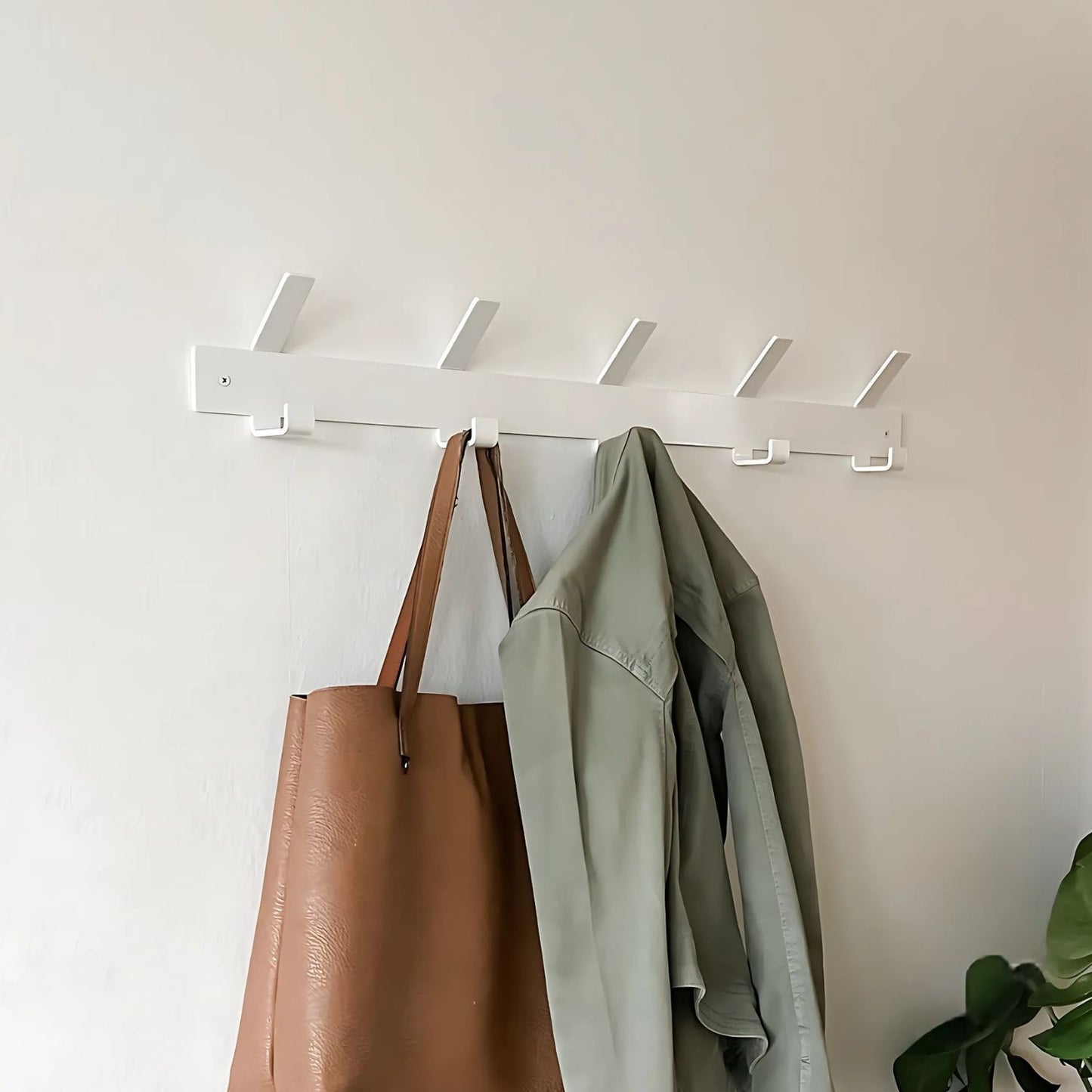 white hook rack with bag and coat