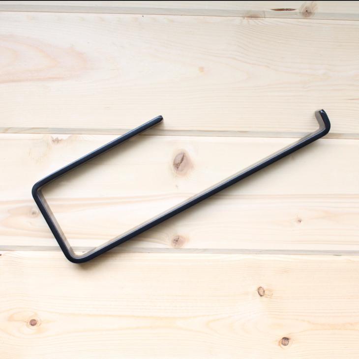 Modern open arm Black Paper Towel Holder on wood background