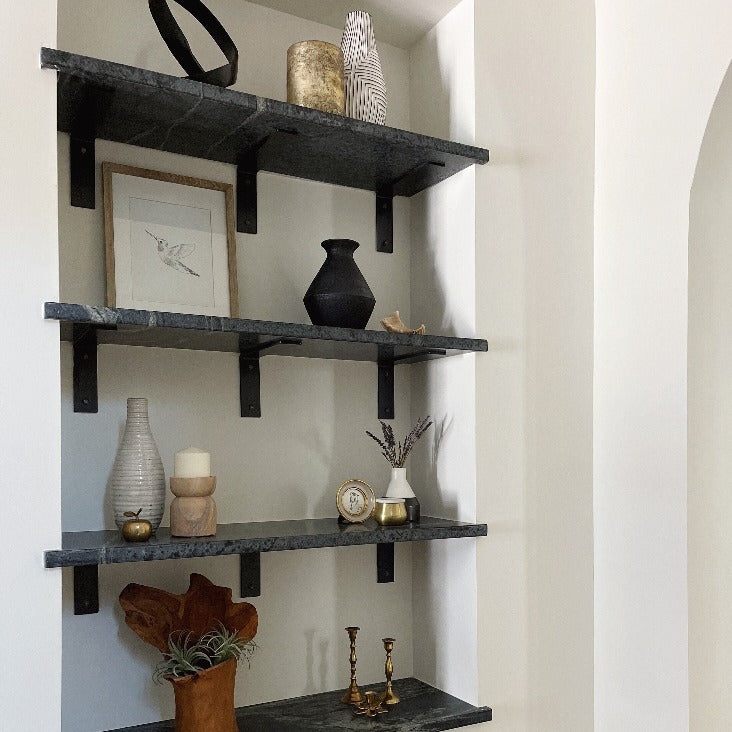 marble shelves with black brackets