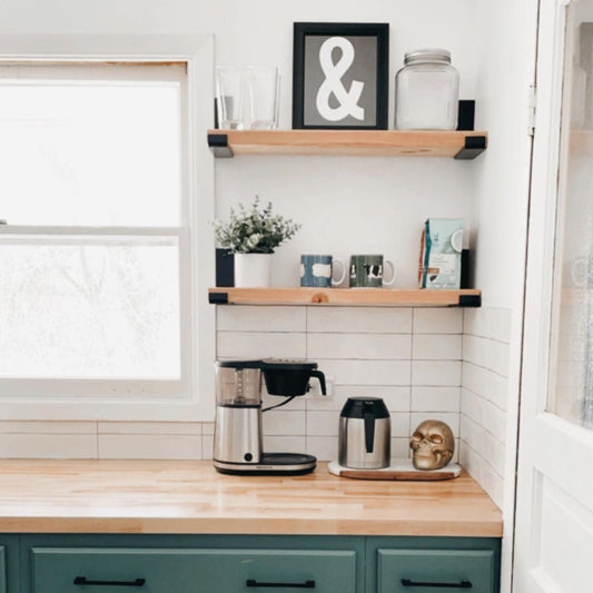 kitchen with two wood shelves and green cabinets