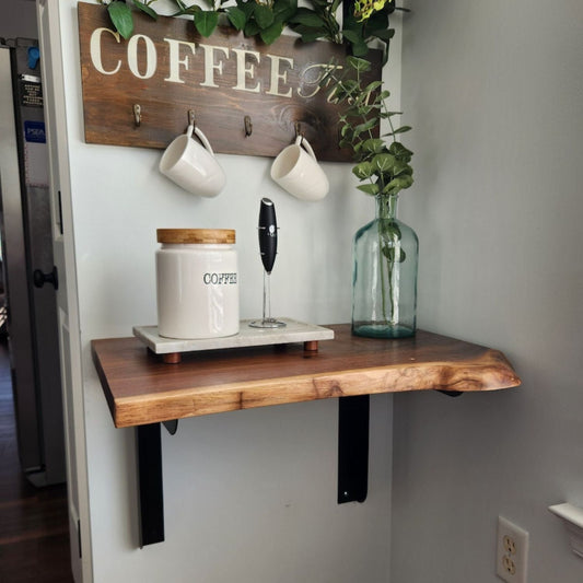 Coffee bar with a wood shelf butcher block with rounded countertop supports mounted on kitchen wall