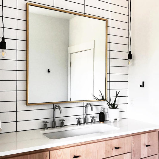 bathroom with white tile and black hardware