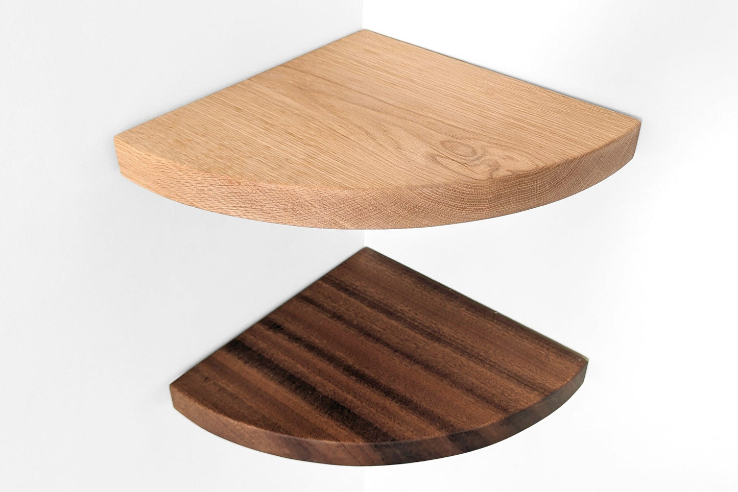 Two wooden corner shelves, one light wood and one dark wood, on a white background.