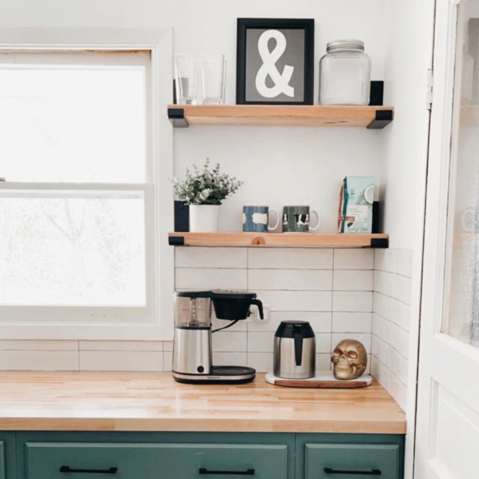 kitchen corner with open shelving and black brackets