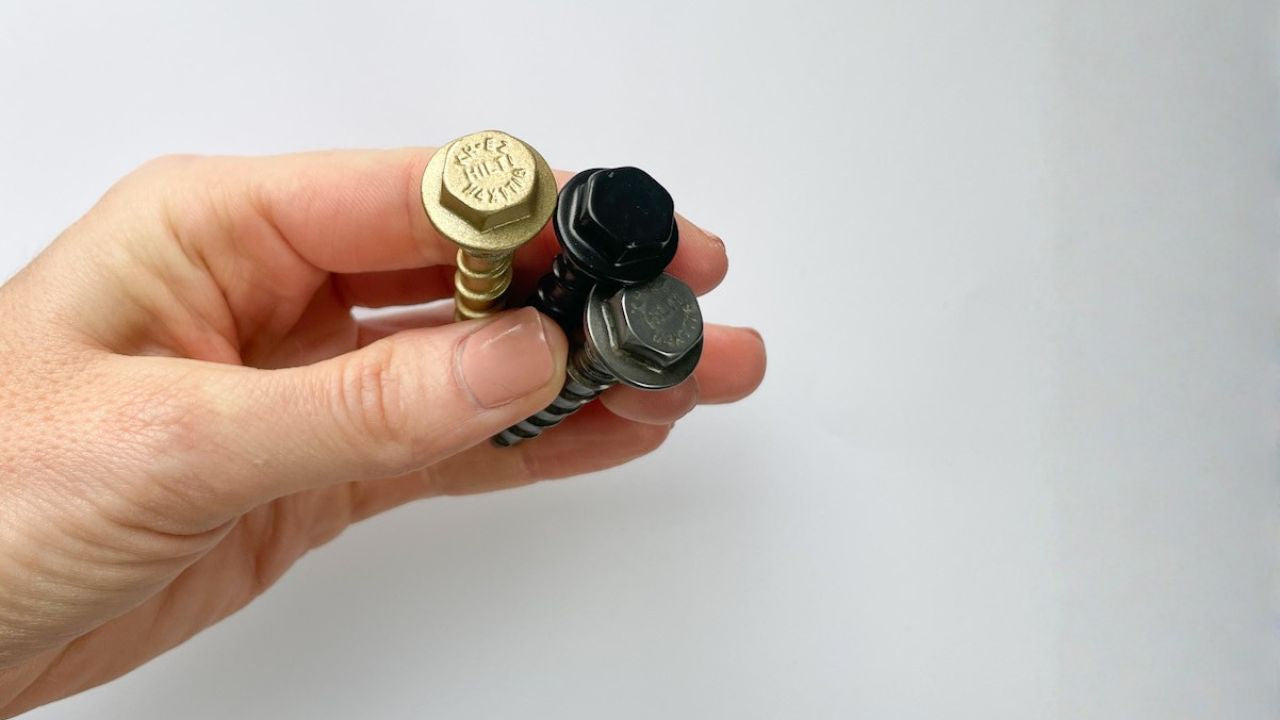 Load video: hand holding three bolts in different colors