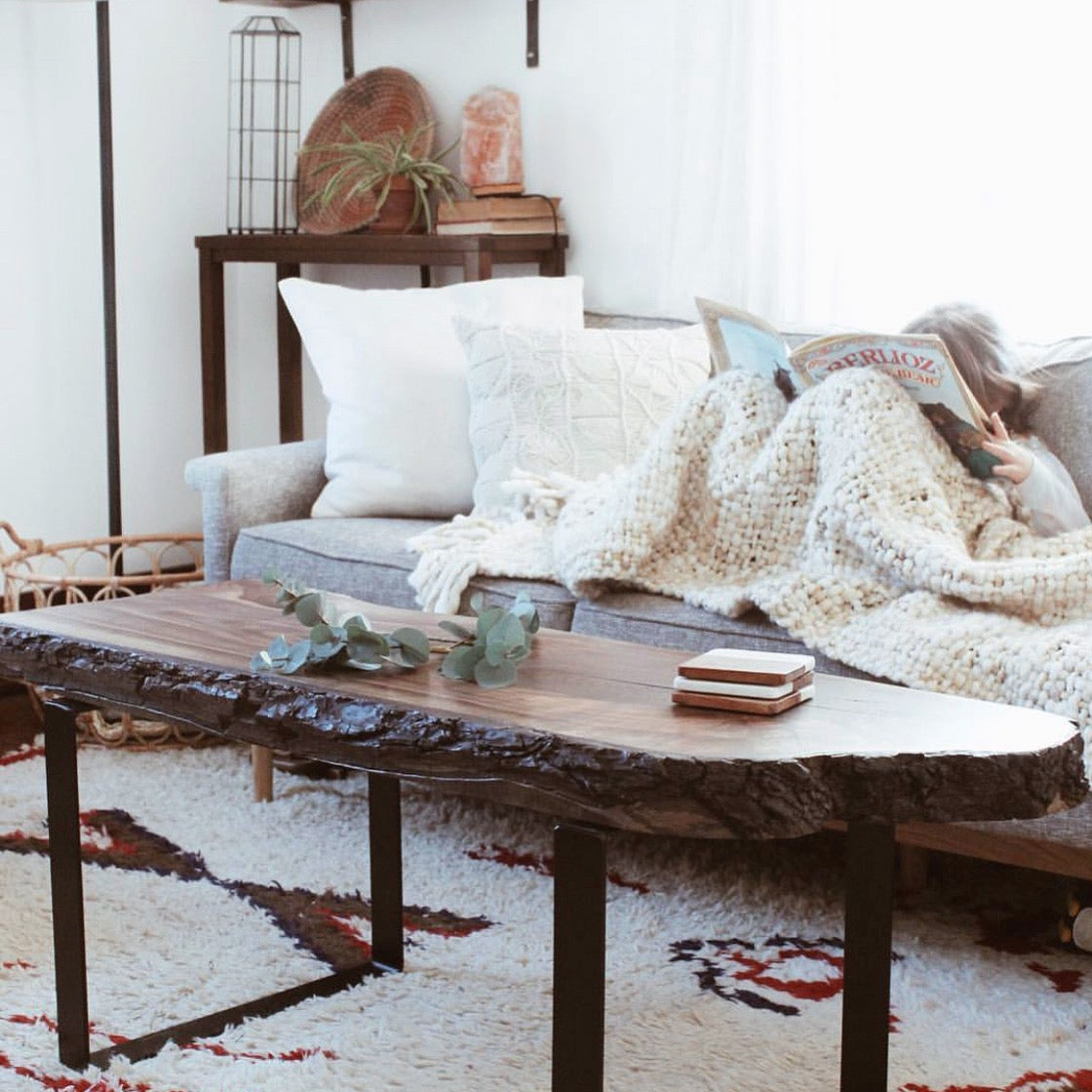 living room with couch and live edge coffee table