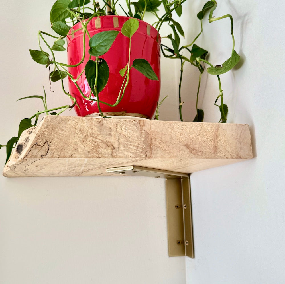 corner wood shelf with brass shelving bracket