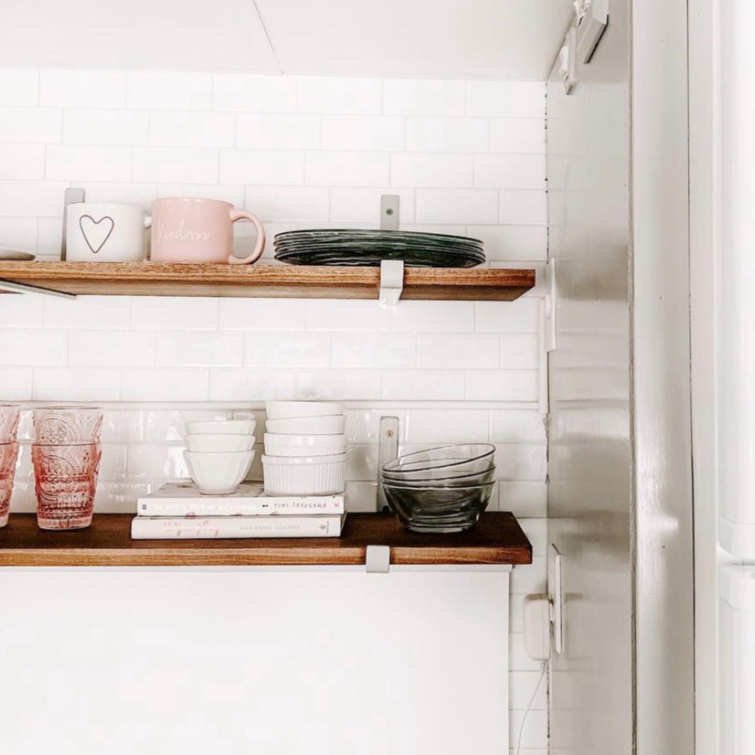 wood shelves with silver hook brackets with pink and white decor