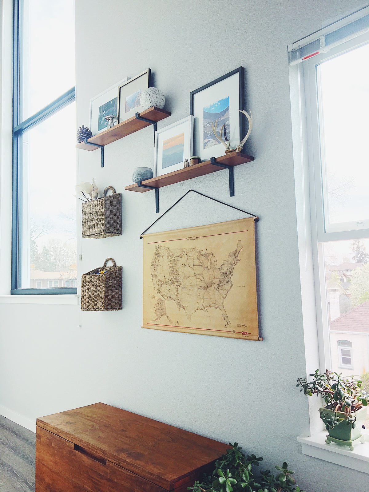 wall with shelves and artwork