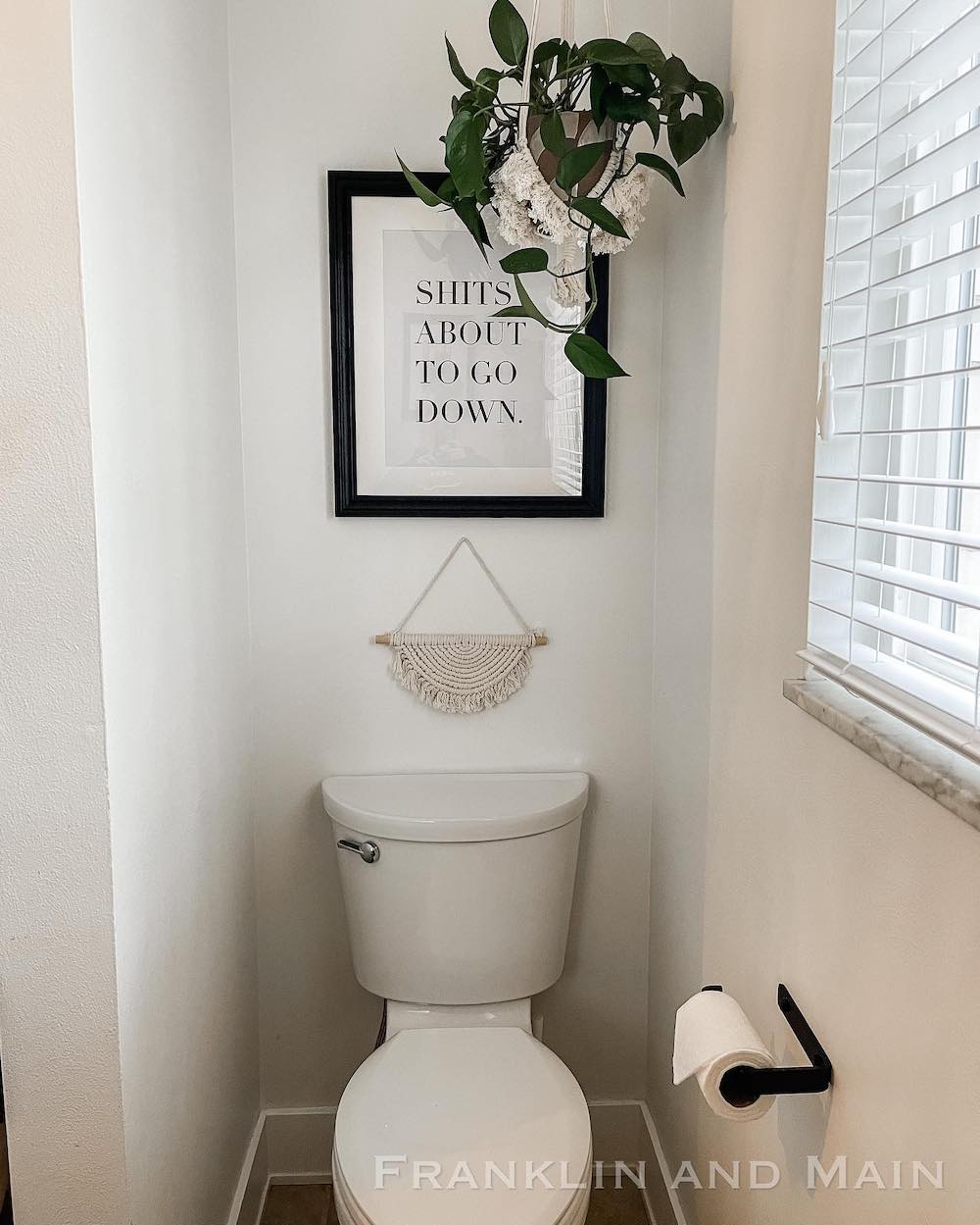 toilet with black toilet roll holder